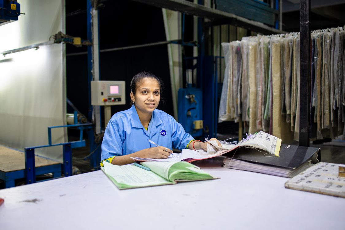 Minimum wages in India 2026 — female worker reviewing documents