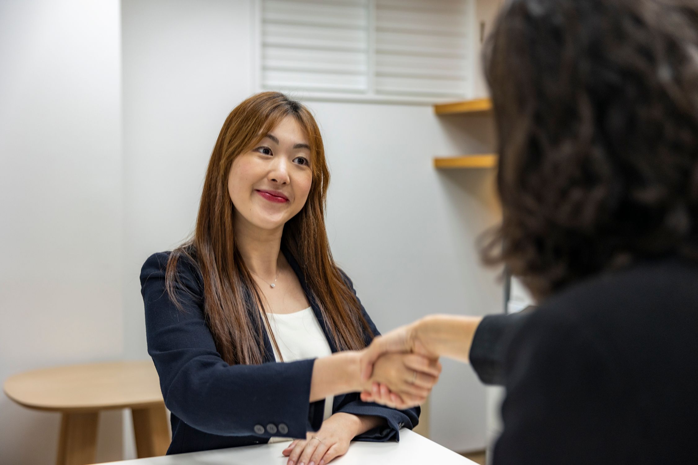 Job placement Hyderabad - recruiter and candidate shaking hands at professional interview