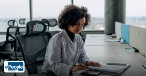 Campus Hiring Hyderabad Employers: Plan a Drive - a professional woman with curly hair calculating documents in a modern