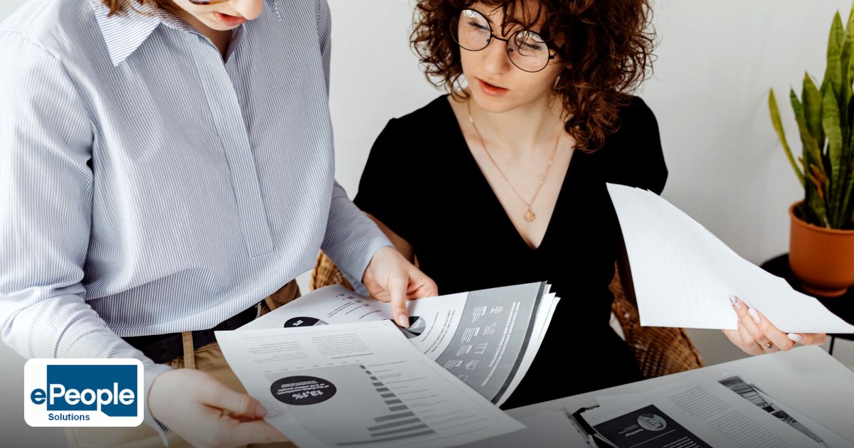 PF & ESI for Contract Workers: Essential Compliance Basics - two women review and discuss financial documents