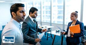 Contract Staffing vs Permanent Hiring in India - business professionals discussing documents in a modern office environment