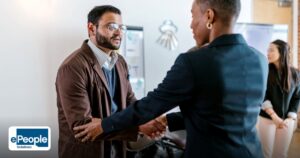 Cross Cultural Corporate Training UAE GCC India Guide - business professionals greeting with a handshake in an office