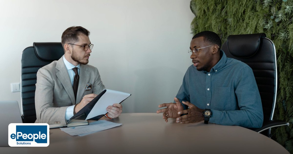 Staffing Agency Hyderabad: How to Choose One - two businessmen engaged in a discussion during a job interview