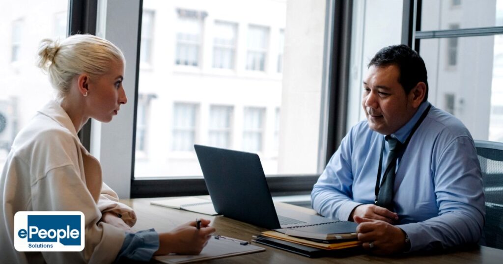 Sales Compensation Plans for India and Qatar Teams - ethnic boss asking question to female candidate filling information