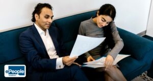 Candidate Screening Best Practices: A Complete Guide - a man and woman in a professional setting discussing paperwork