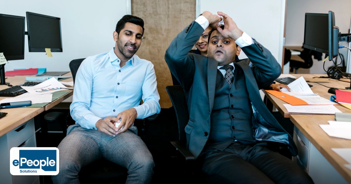 Legal Considerations Indian Recruiters GCC Freelancers 2026 - two men in an office setting with computers and paperwork,