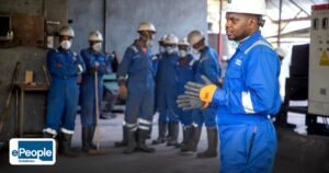 Staffing for Manufacturing India: Industry‑Specific Insights - a group of factory workers in safety gear receiving training