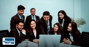 Third Party Payroll Staffing India: Benefits and Risks - a diverse team of professionals collaborating around a laptop